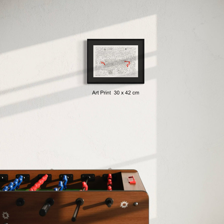 Fine art print framed next to futbolin