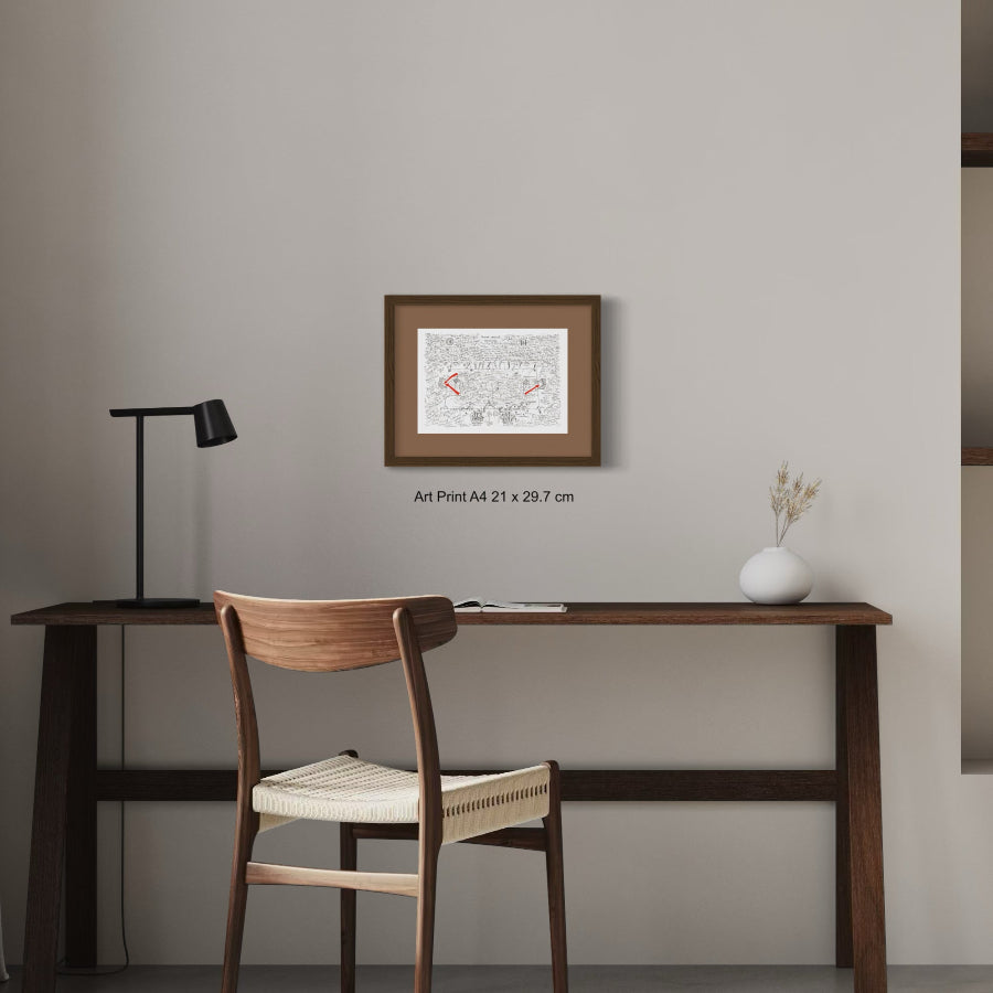 Fine art print A4 size on grey wall above wooden table
