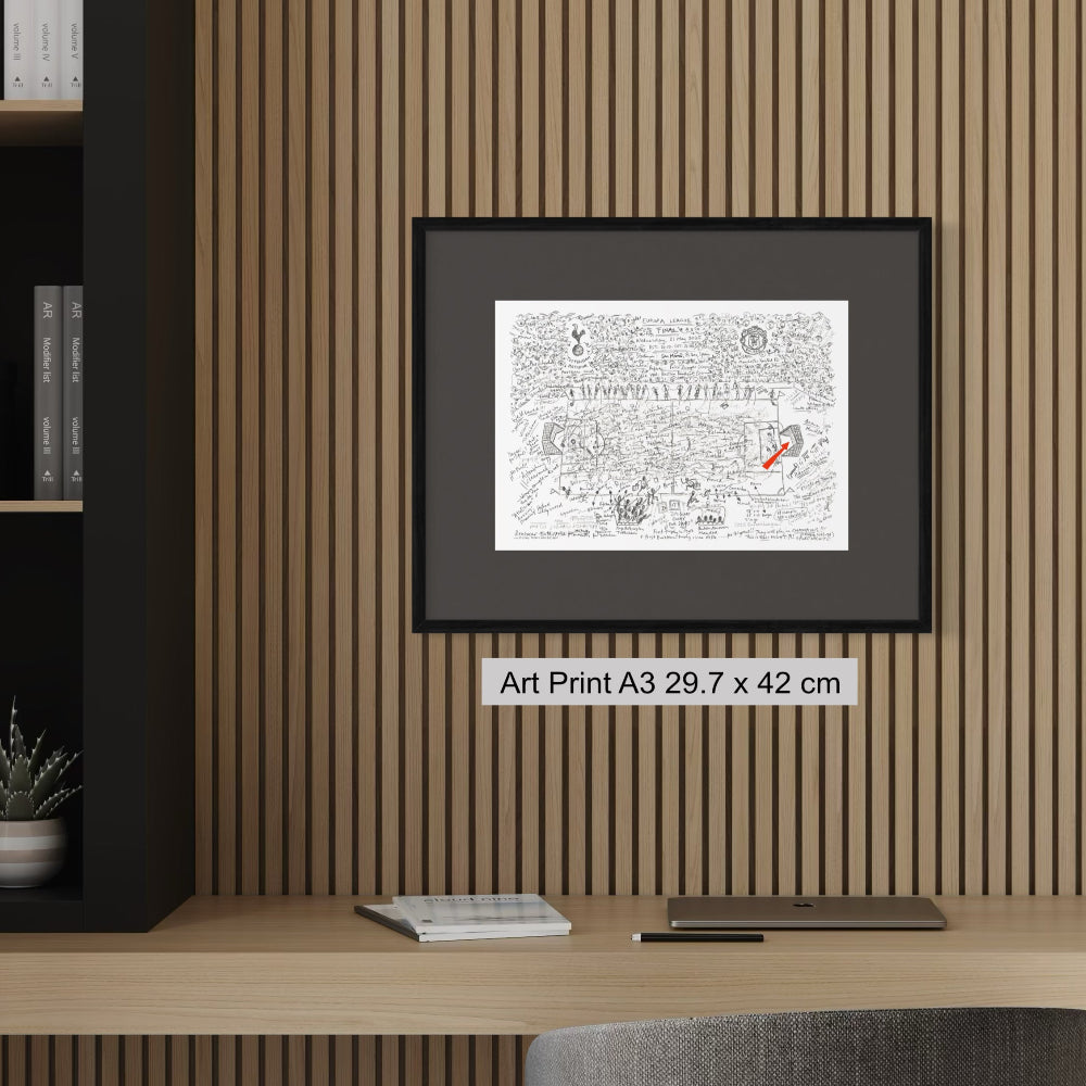 Framed A3 fine art print on wood panel wall on top of desk