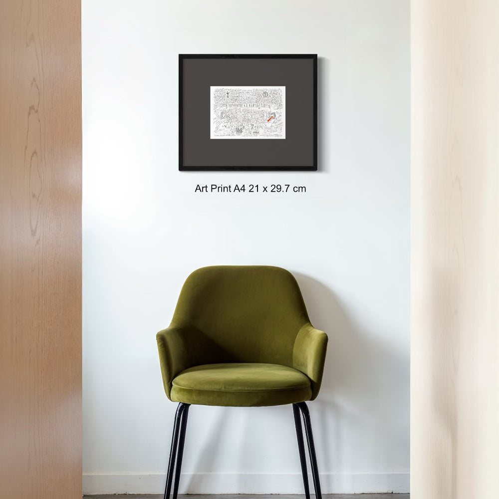 Framed fine art print A4 size with wide matt black frame on white wall above cool chair